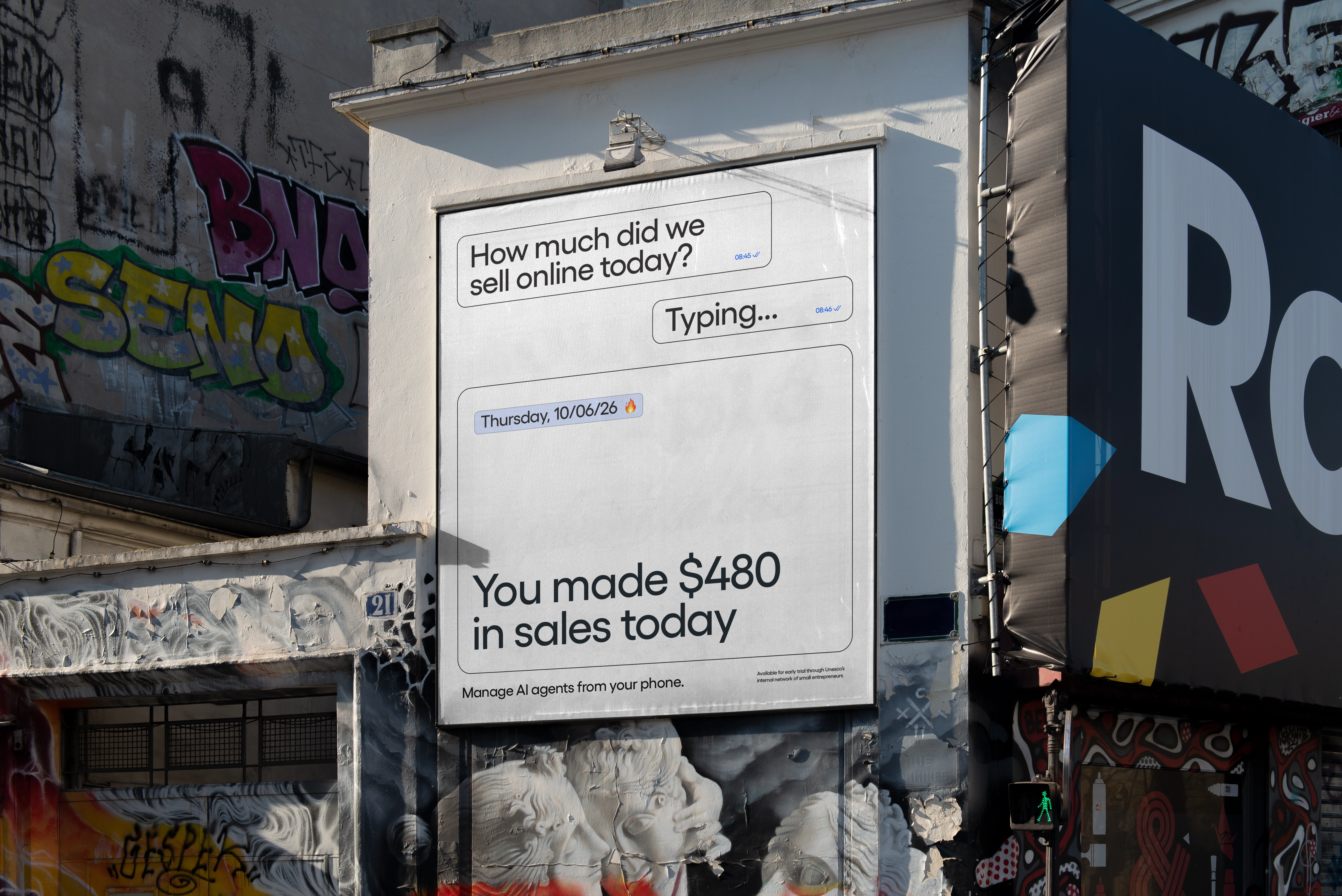 UNESCO project billboard showing a mobile conversation about daily online sales and the message Manage AI agents from your phone